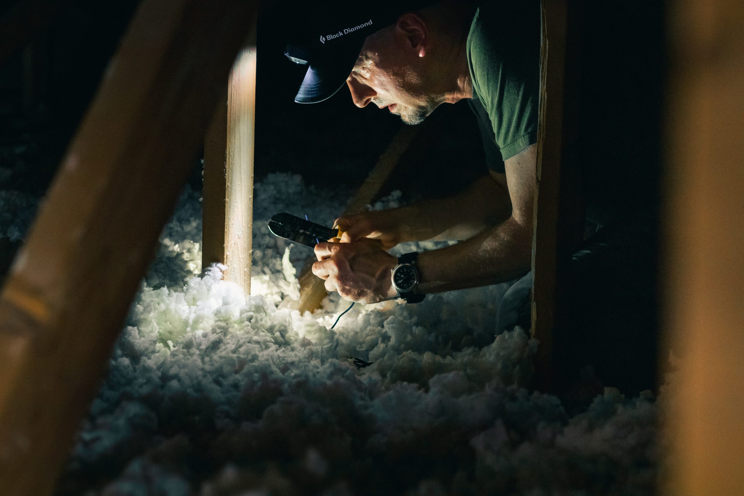 Man with headlamp fitting insulation